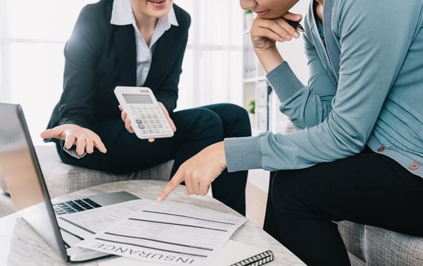 Insurance agent going over policy with customer