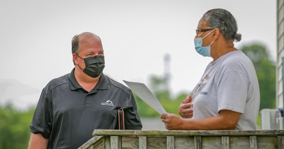 Marty with homeowner for claim adjusting