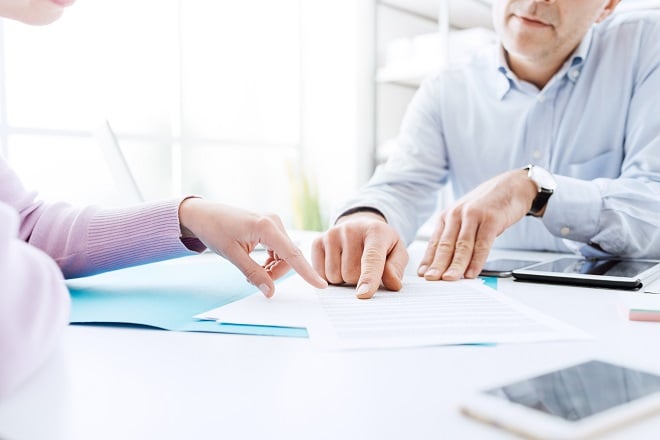 male insurance agent explaining documents to client