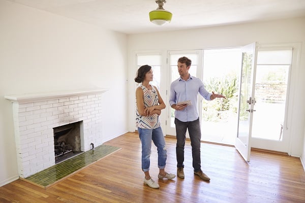 realtor showing woman house