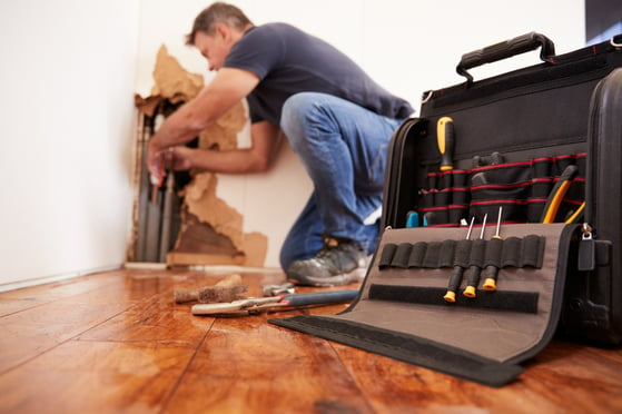 repair man working in house