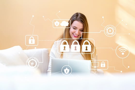 smiling girl at home with laptop