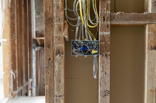 wall studs with modern electrical box