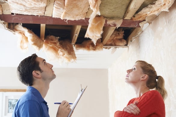 woman getting estimate for home storm damage